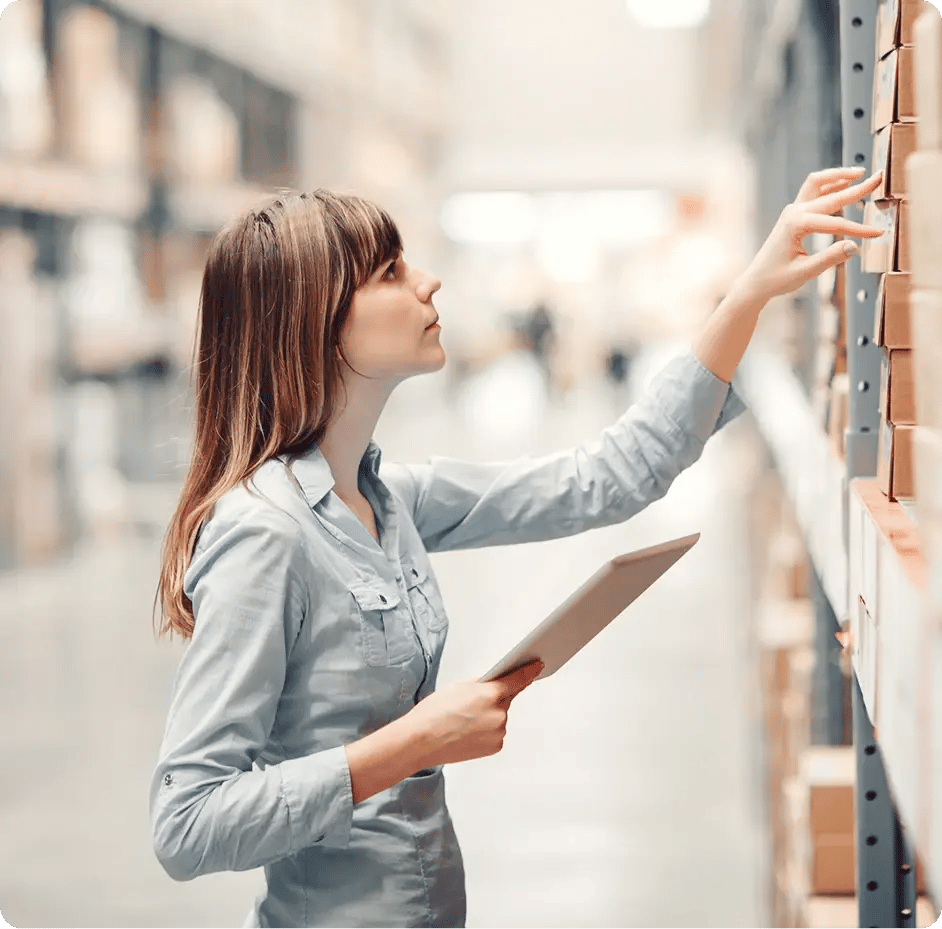 Inventory manager scanning warehouse stock
