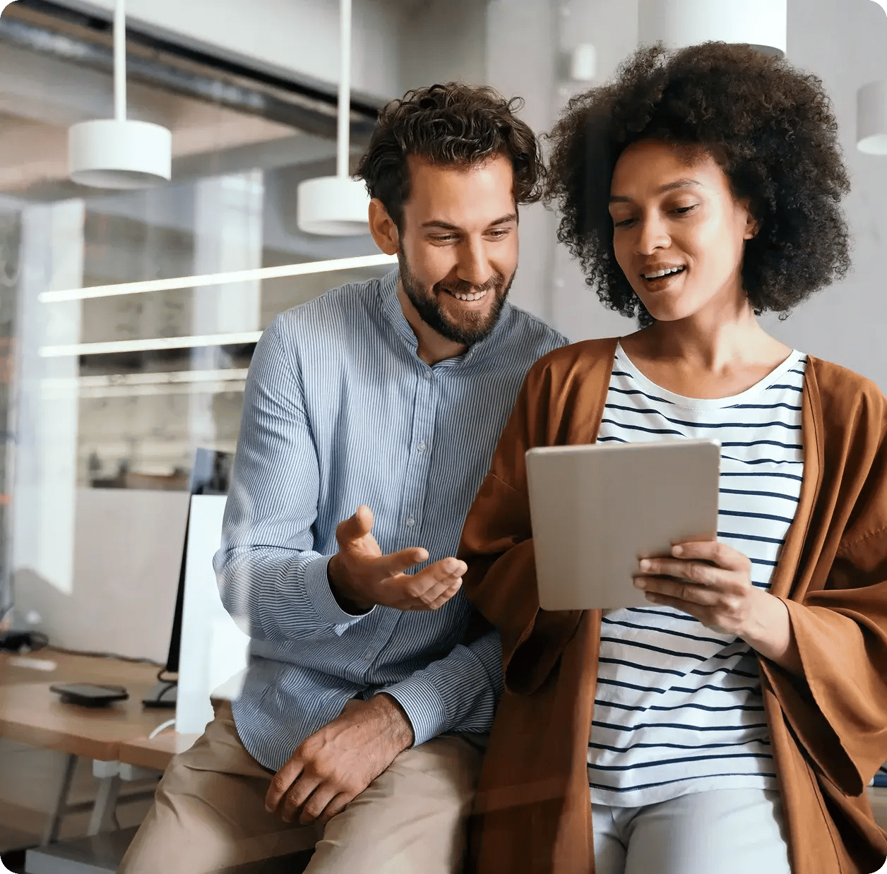 couple-looking-at-tablet