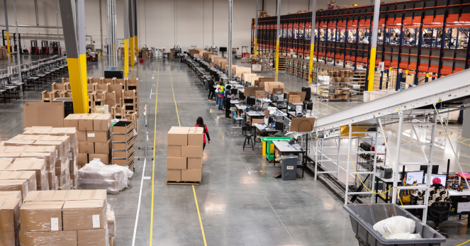 busy warehouse with boxes being pulled on a dolley